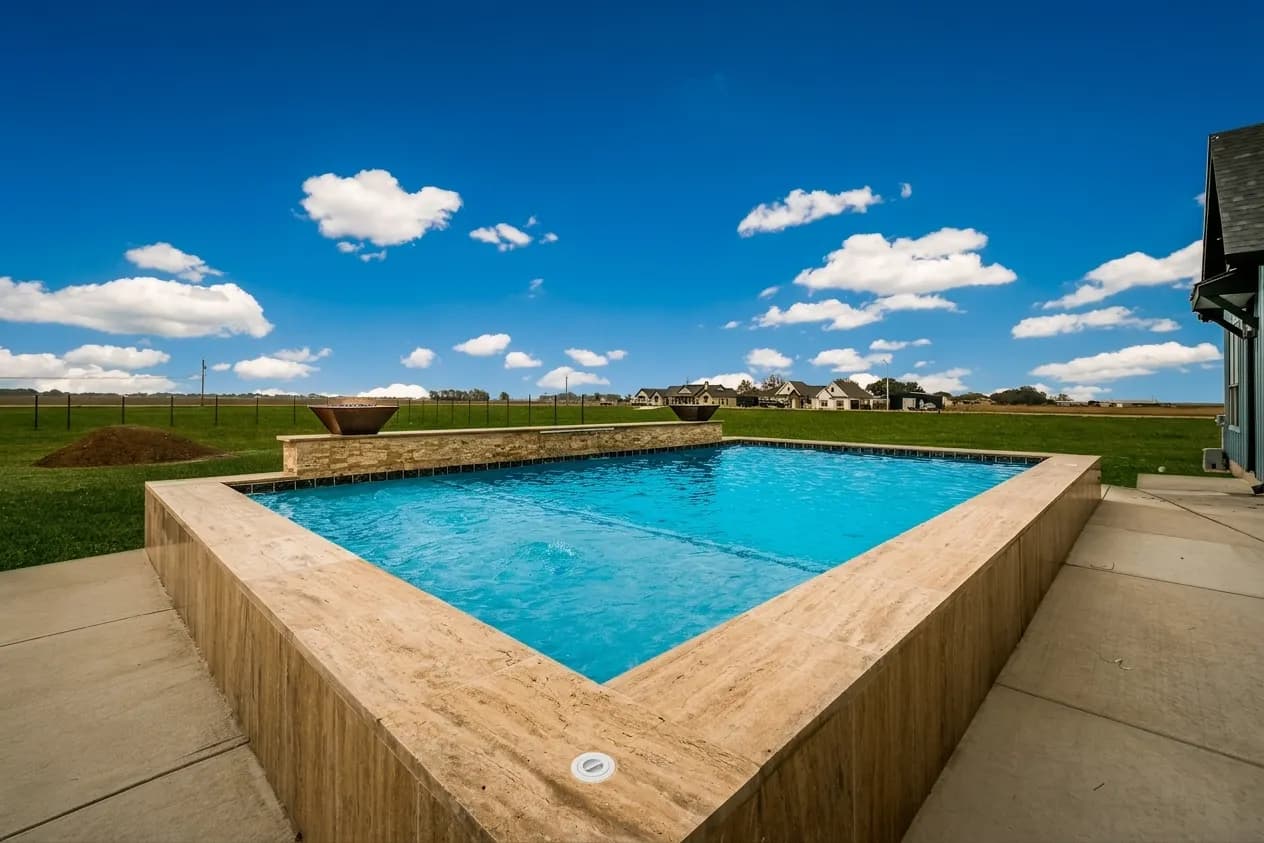 Turner Custom Pools — finished pool with fire bowls in Hill Country, built for your lot not a catalog