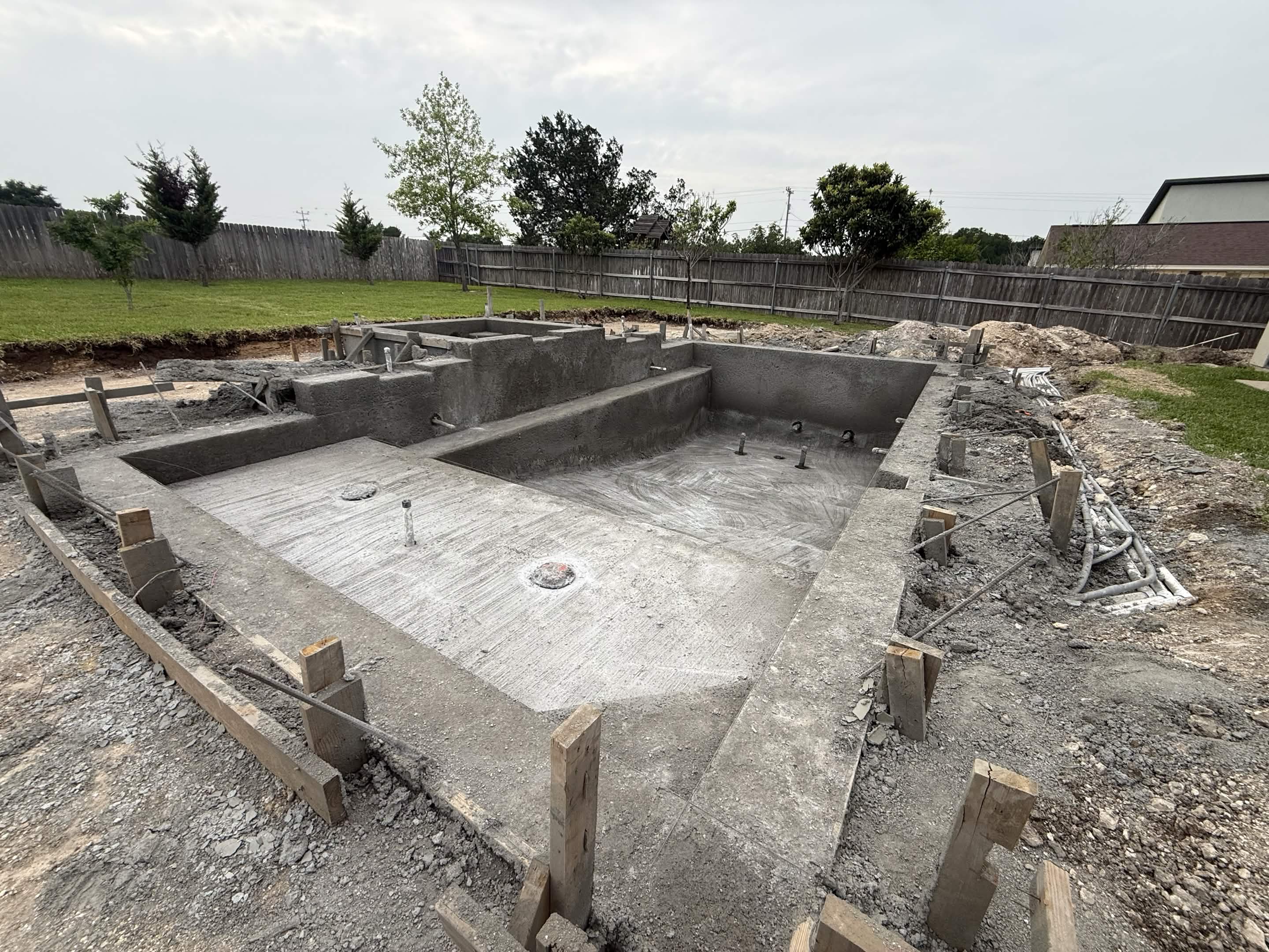 Gunite pool shell — concrete sprayed over steel rebar framework